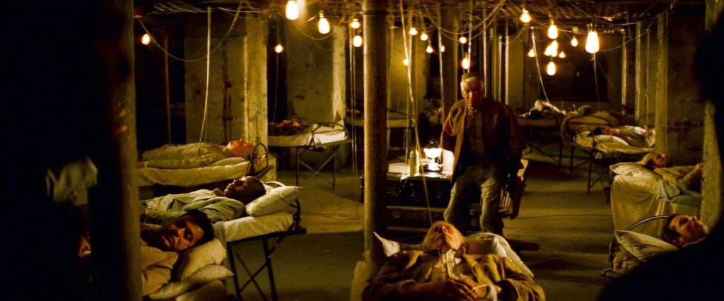A scene still from Inception, where the people are sleeping in the basement with the IVs attached.